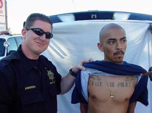 Guy getting arrested with Fuck The Police tat on his chest.